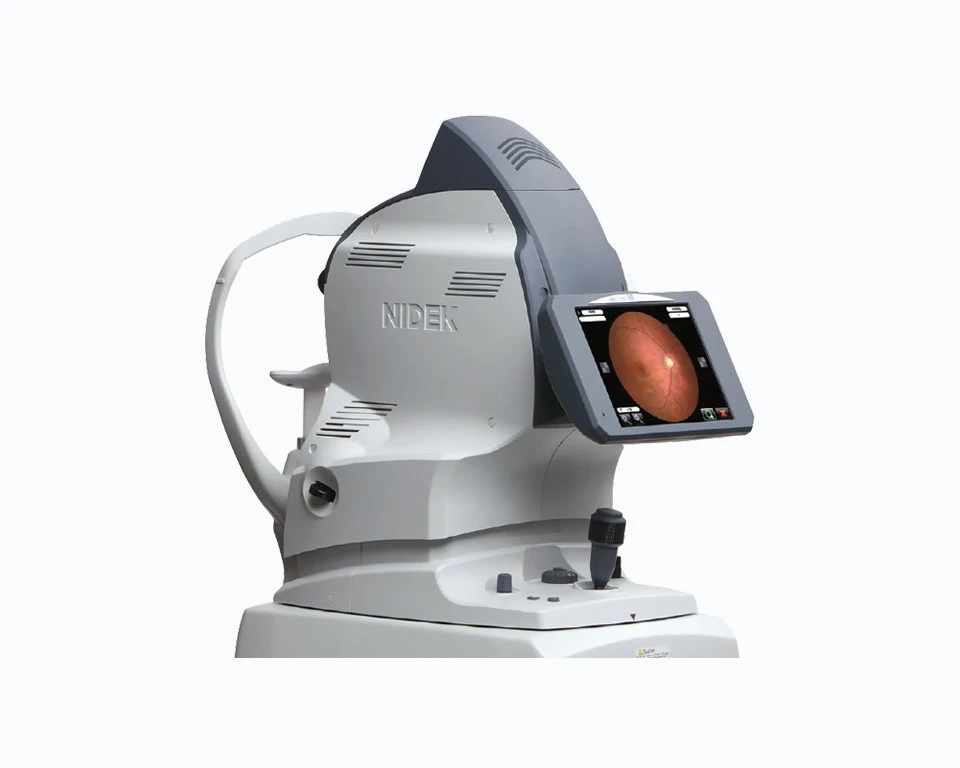 The Nidek Medical Imaging Device Prominently Displays Its Brand Name. This Sophisticated Equipment Features A Digital Screen Showcasing A High-Resolution Image Of A Retina. The White And Grey Device Is Equipped With Various Buttons And Knobs For Precise Control.