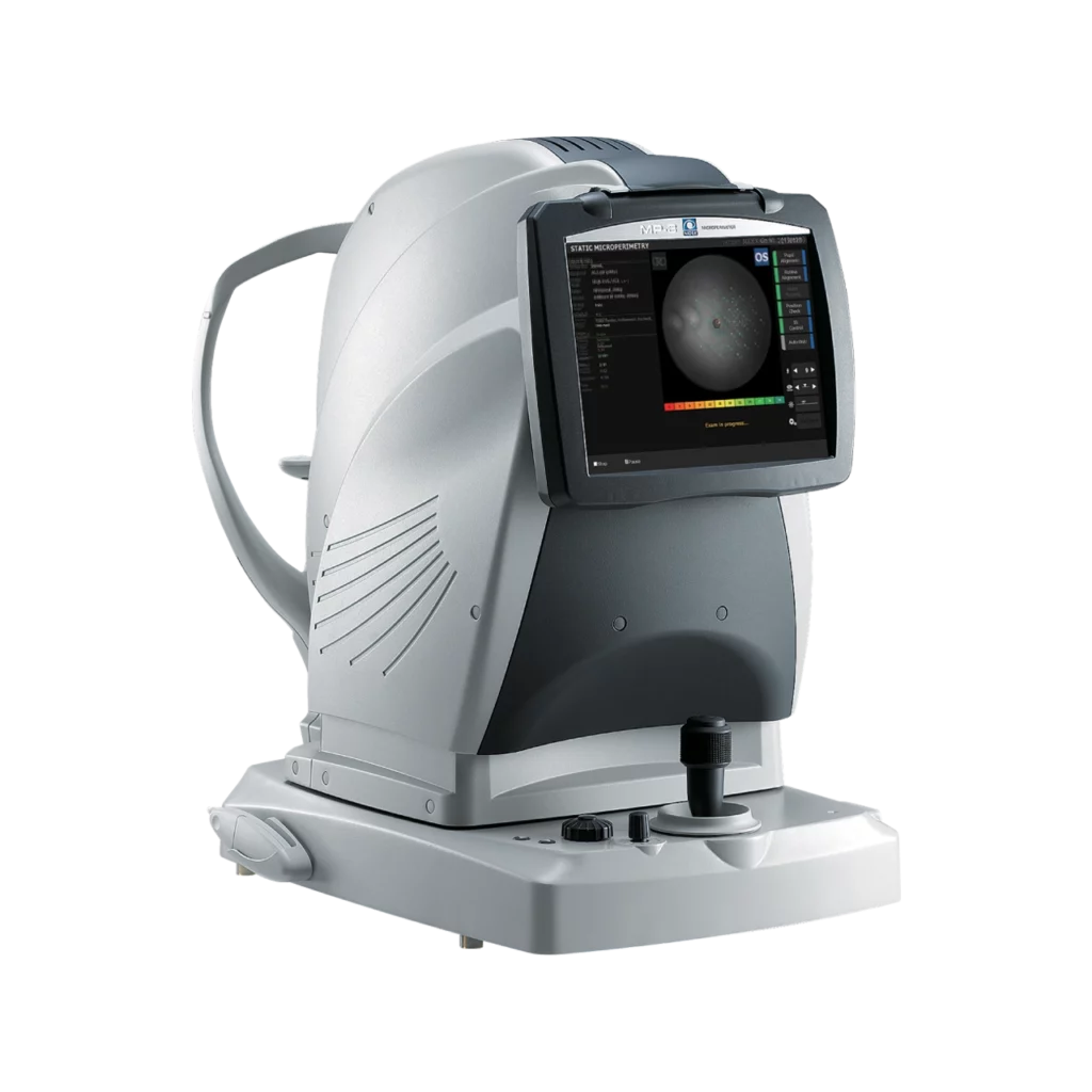 A Nidek Medical Device With A Digital Screen, Used For Eye Examination. The Machine Features Buttons, Knobs, And A Viewing Lens. The Screen Displays An Image Of An Eye, Illustrating Its Use In Ophthalmology For Detailed Eye Analysis Or Diagnostics.