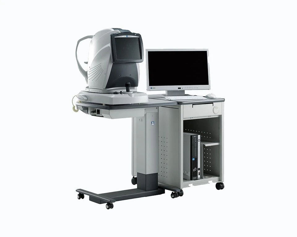 A High-Tech Nidek Ophthalmic Imaging Device On A Wheeled Stand Next To A Desktop Computer With A Monitor. The Setup, Likely Used For Eye Examinations And Diagnostics, Features An Ergonomic Design With A Light Gray And Black Color Scheme.