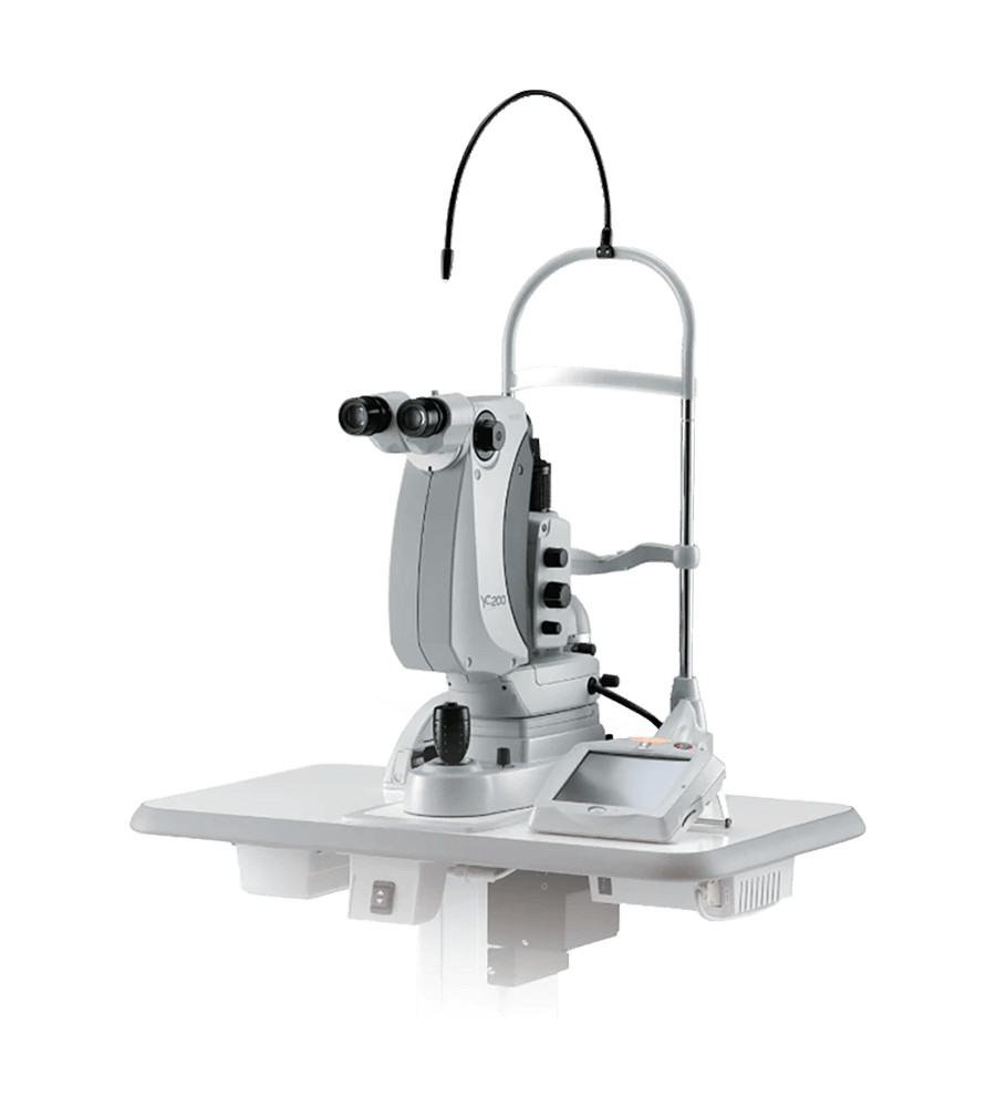 A Nidek Medical Device Featuring Dual Eyepieces On A Mounted Stand, Commonly Used For Eye Examinations. It Has A Sleek, Silver Finish, Various Controls, And Is Equipped With A Flexible Light Source. The Unit Is Positioned On A White, Flat Surface.