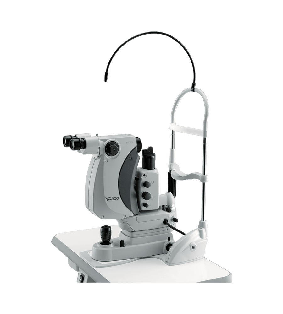 The Image Shows A Nidek Ophthalmic Yag Laser Machine Used For Eye Treatments, Mounted On A White Base. The Device Has Binocular Eyepieces, An Adjustable Arm, And Control Knobs For Precision Adjustments During Procedures. A Curved, Black Cord Is Attached Above It.