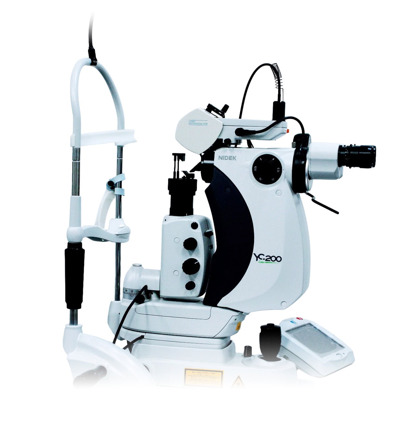 A Nidek Medical Device, Identified As The Yc-200, Is Used For Ophthalmic Procedures. The Machine Features A Binocular Eyepiece, Various Control Knobs, And A Laser Component. It Is White With Black Accents And Has Several Cables Attached.