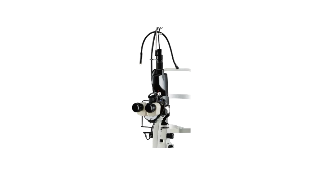 A High-Tech Nidek Ophthalmic Microscope Against A Black Background, Featuring Lenses, Adjustment Knobs, And Various Components For Surgical Precision In Eye-Related Procedures. The Design Is Sleek And Sophisticated, Highlighting The Advanced Technology Of The Equipment.
