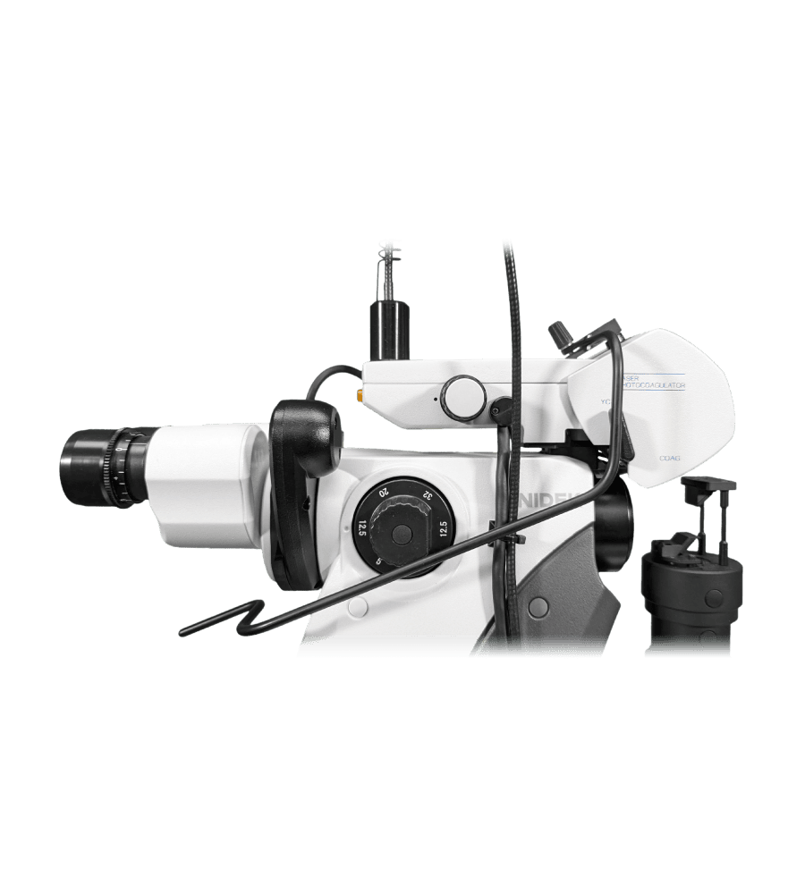 A Side View Of A White Zeiss Proergo Dental Microscope, Featuring Various Adjustment Knobs, Lens Attachments, And Electrical Cords. The Microscope Is Designed For Precise Dental Procedures, Providing Enhanced Visibility And Magnification.